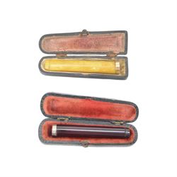 Amber gold mounted cheroot holder, 12.5 ct hallmarked, cased, together with another gold mounted example and various others, and silver mounted pipe 