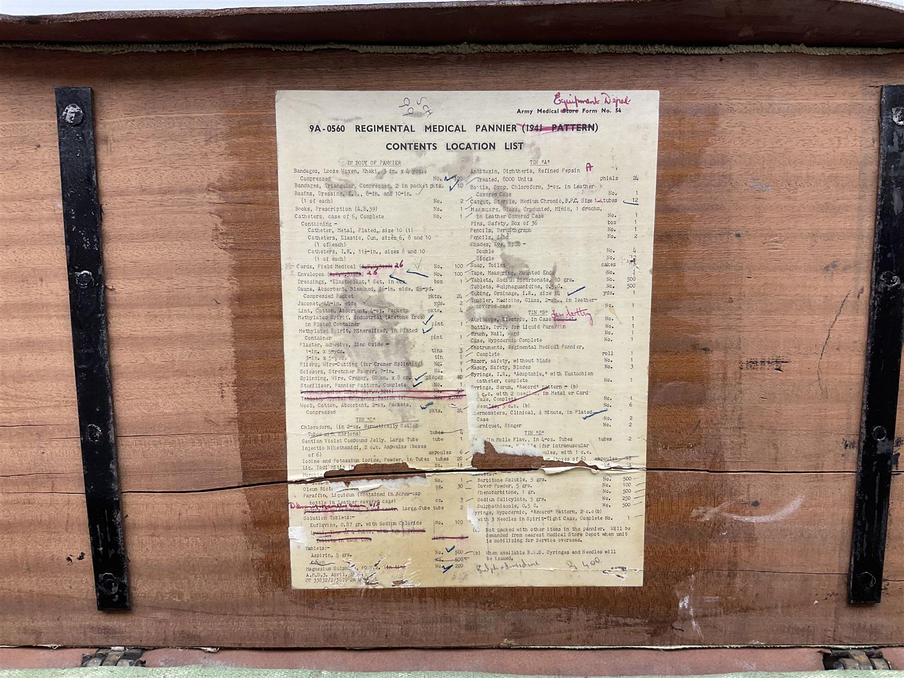 WW2 British Army RAMC 'Regimental Medical Pannier', well marked externally and dated 1941, stamped May 1943 internally, canvas covered wicker form with leather edges, hinged top and fall front with two rope carrying handles, fitted iron locking straps with securing chains; contains various unused field dressings and bandages with WW2 dates and two pillows; original label under lid L79cm