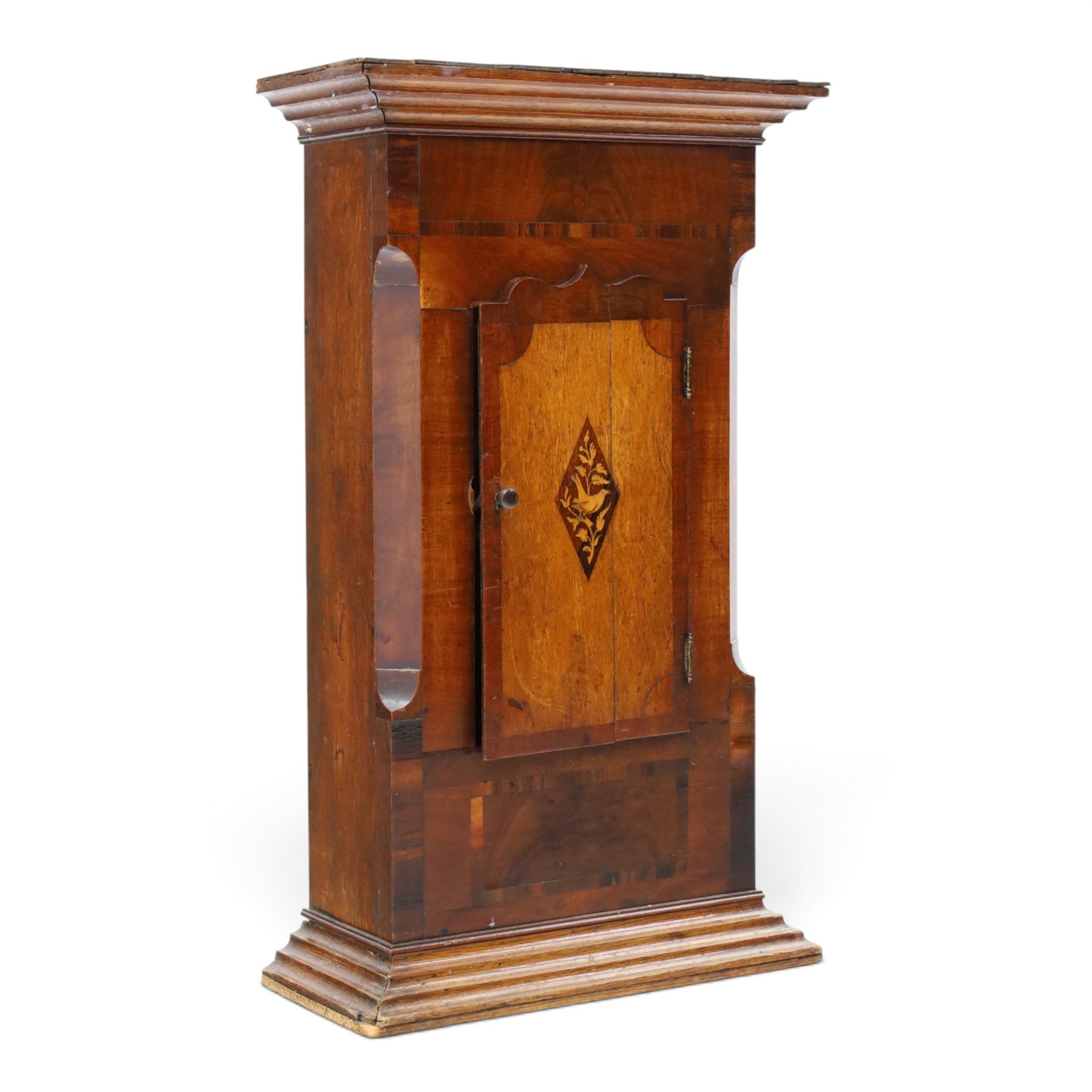 19th century clock trunk cupboard, veneered front with cantered corners, stepped plinth base