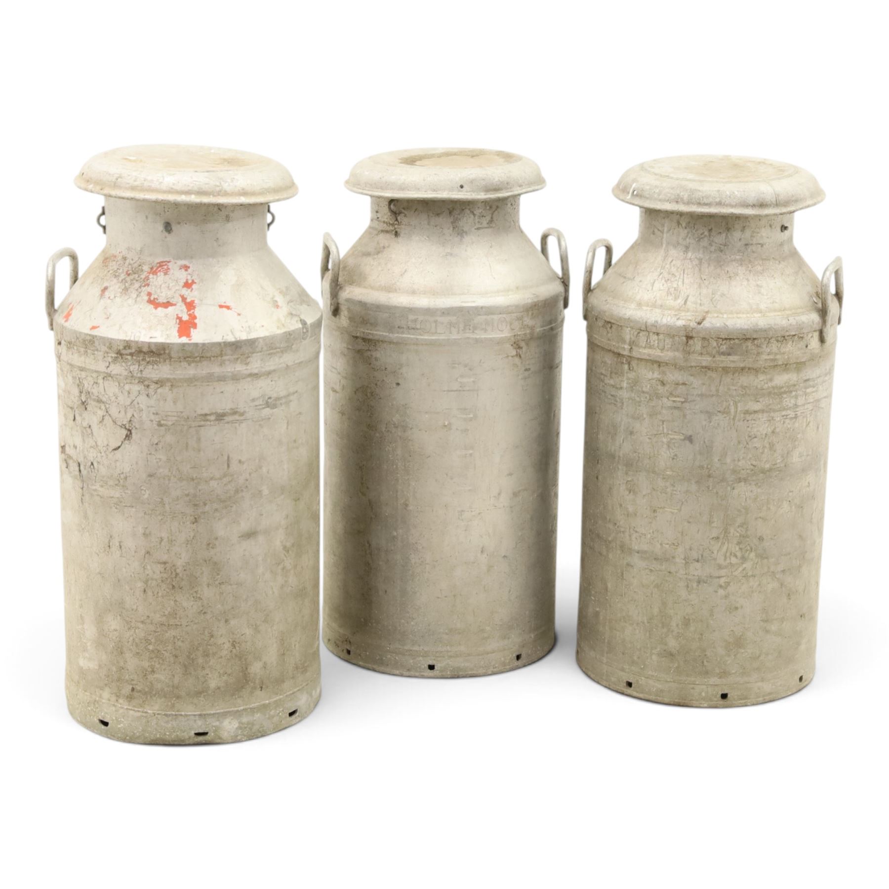 20th century aluminium set of three milk churns, with handles, baring the stamps of 'Middlesborough Co-op', 'Holme Moor', 'Wholesale Dairies' 