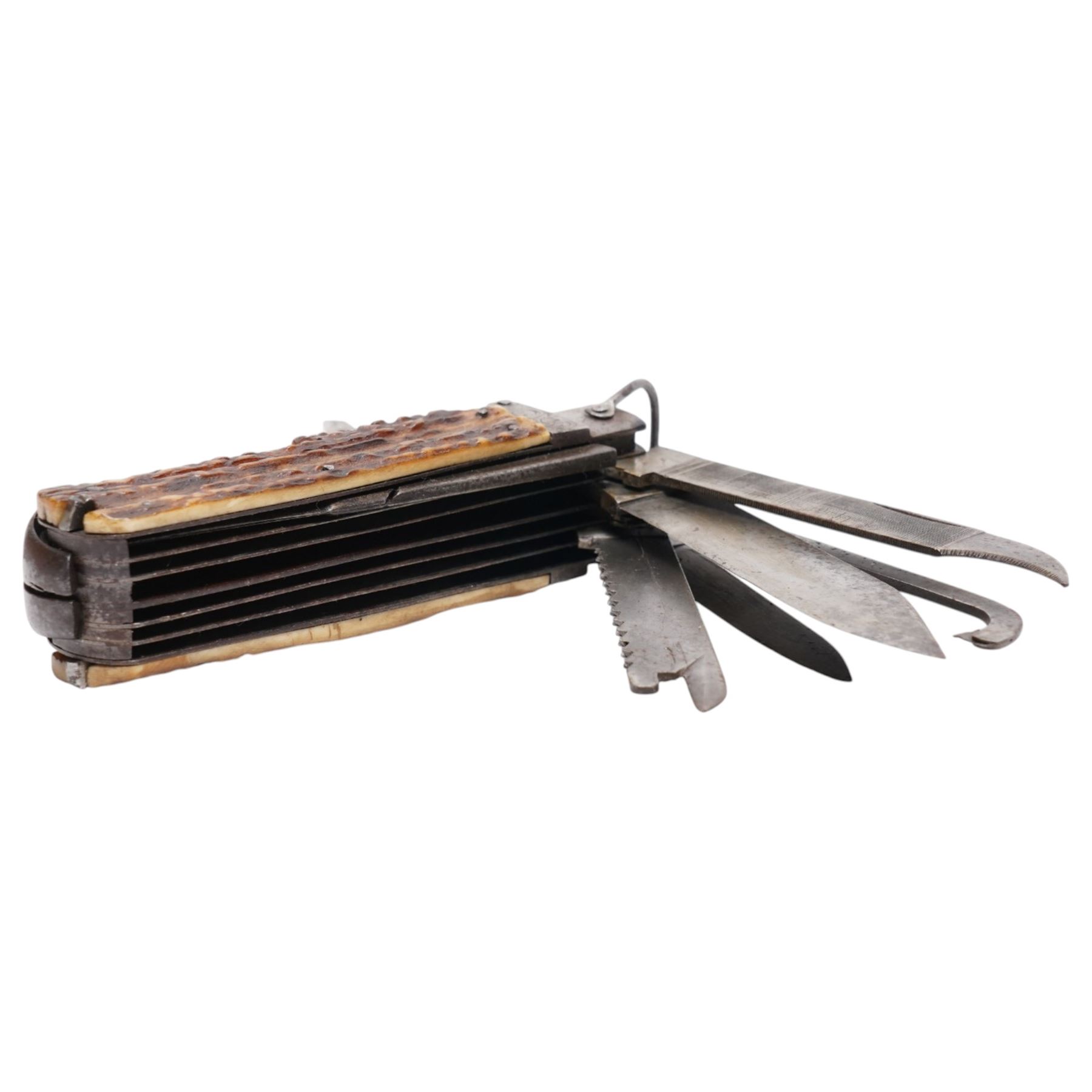 19th century coachman's folding pocket knife, the steel frame engraved with chevrons and tendrils, with antler grip scales, including set with a coachman`s key, leather punch, corkscrew, hoofpick, knife blades etc
