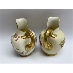 Two Royal Worcester blush ivory jugs, each decorated with flowers, shape number 1094 