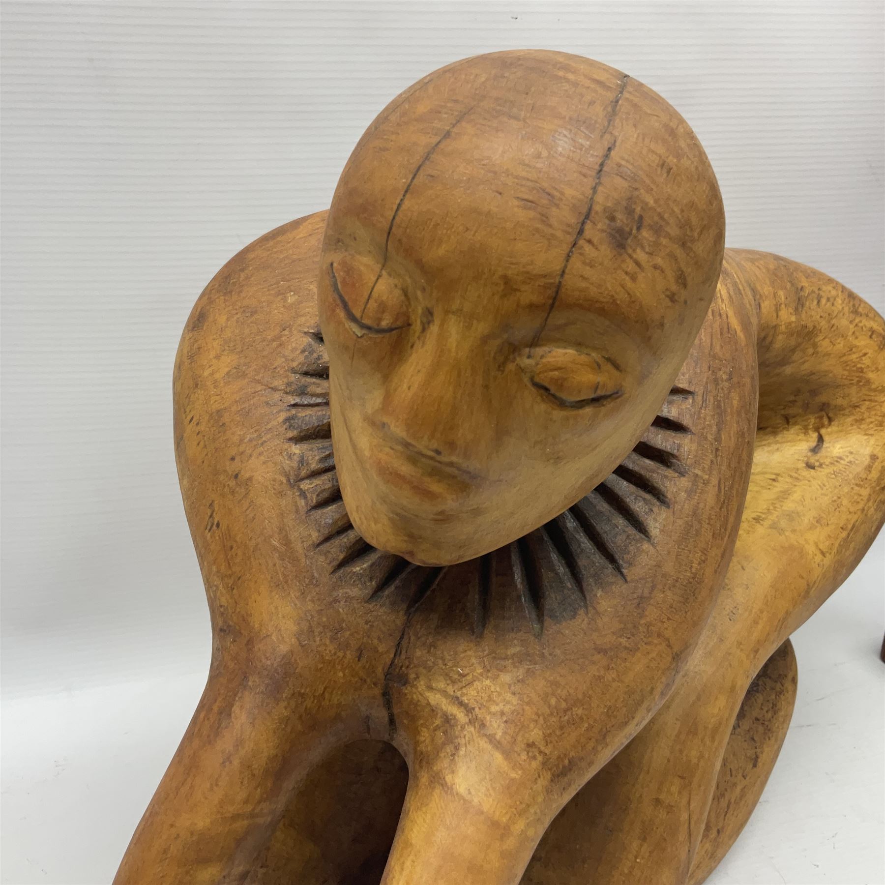 Helen Skelton (British 1933 – 2023): Three carved wooden abstract sculptures, each modelled as a a figure, tallest H52cm. Born into an RAF family in 1933 in Kent and travelled the world extensively during her childhood. After settling in Bridlington, Helen immersed herself in painting, textiles, and wood sculpture, often inspired by nature's beauty. Her talent was showcased in a one-woman show at Sewerby Hall and recognised with the sculpture prize at Ferens Art Gallery in 2000. Sadly, Helen’s daughter passed away from cancer in 2005. This loss inspired Helen to donate her sculptures to Marie Curie upon her passing in 2023.