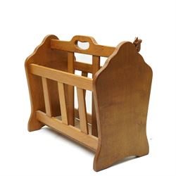 Squirrelman - oak magazine rack, the shaped ends enclosing a central slatted support with carrying aperture, enclosed by slatted sides and base, with carved squirrel signature, by Wilfrid Hutchinson of Husthwaite
