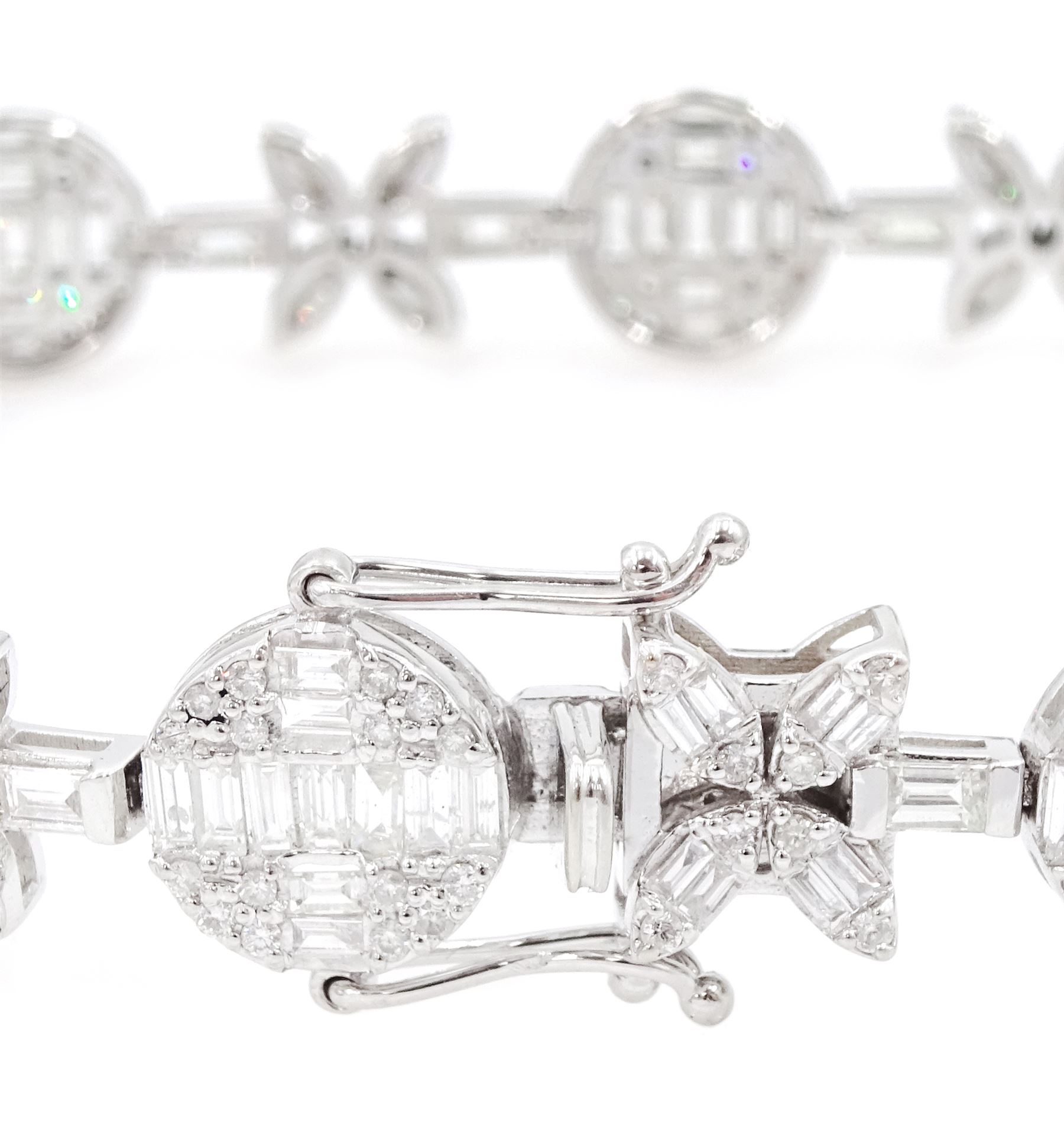 18ct white gold diamond bracelet, eight circular, pave set round brilliant cut and baguette cut diamond clusters, spaced by a single baguette cut diamond and a diamond flower head design cluster, stamped 750, total diamond weight approx 3.70 carat