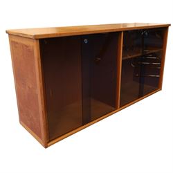 Light oak bookcase cabinet, fitted with four sliding tinted glass doors