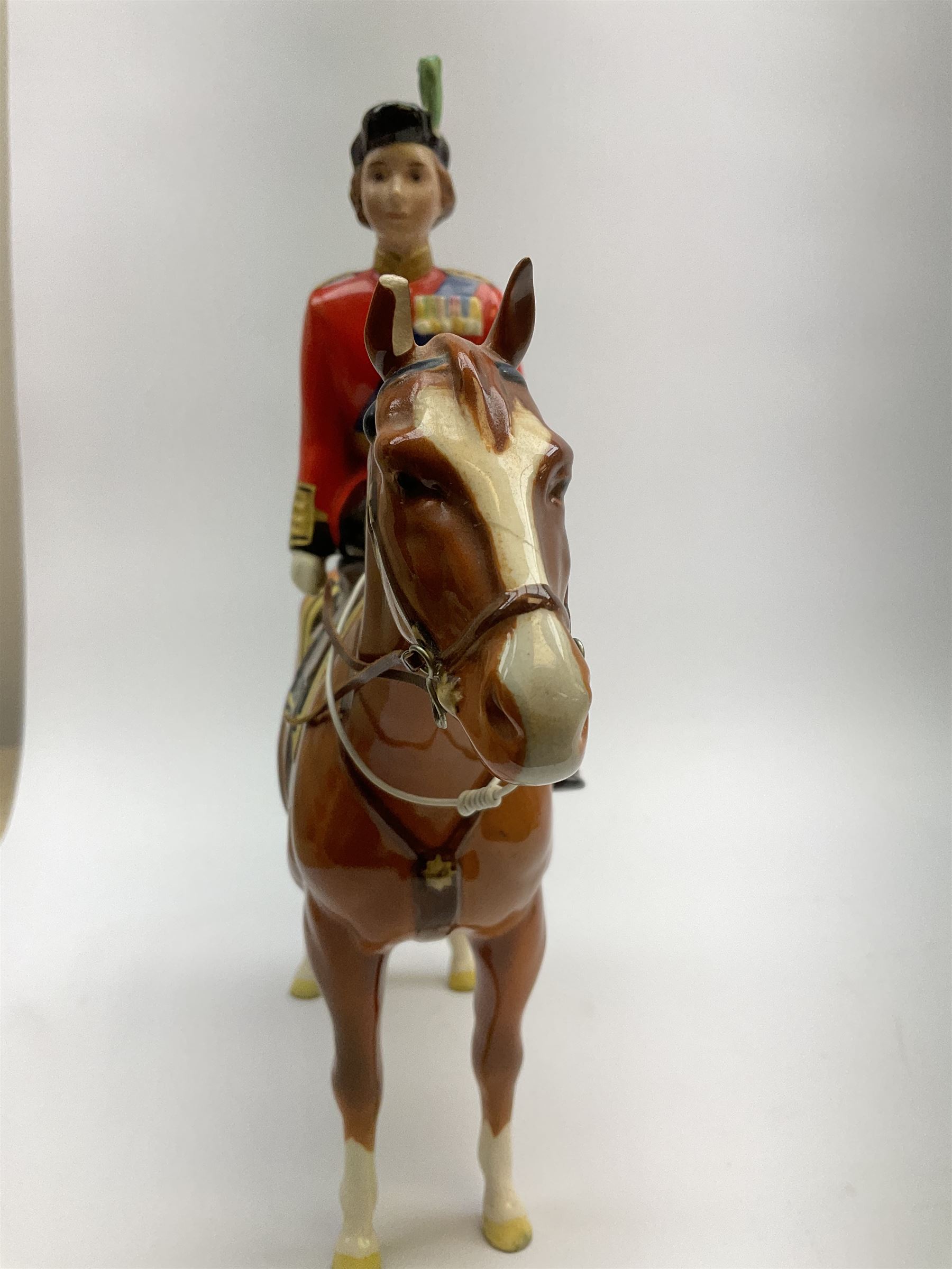A Beswick model of HM Queen Elizabeth II mounted on Imperial Trooping the colour 1957, model no 1546, H26.5cm.