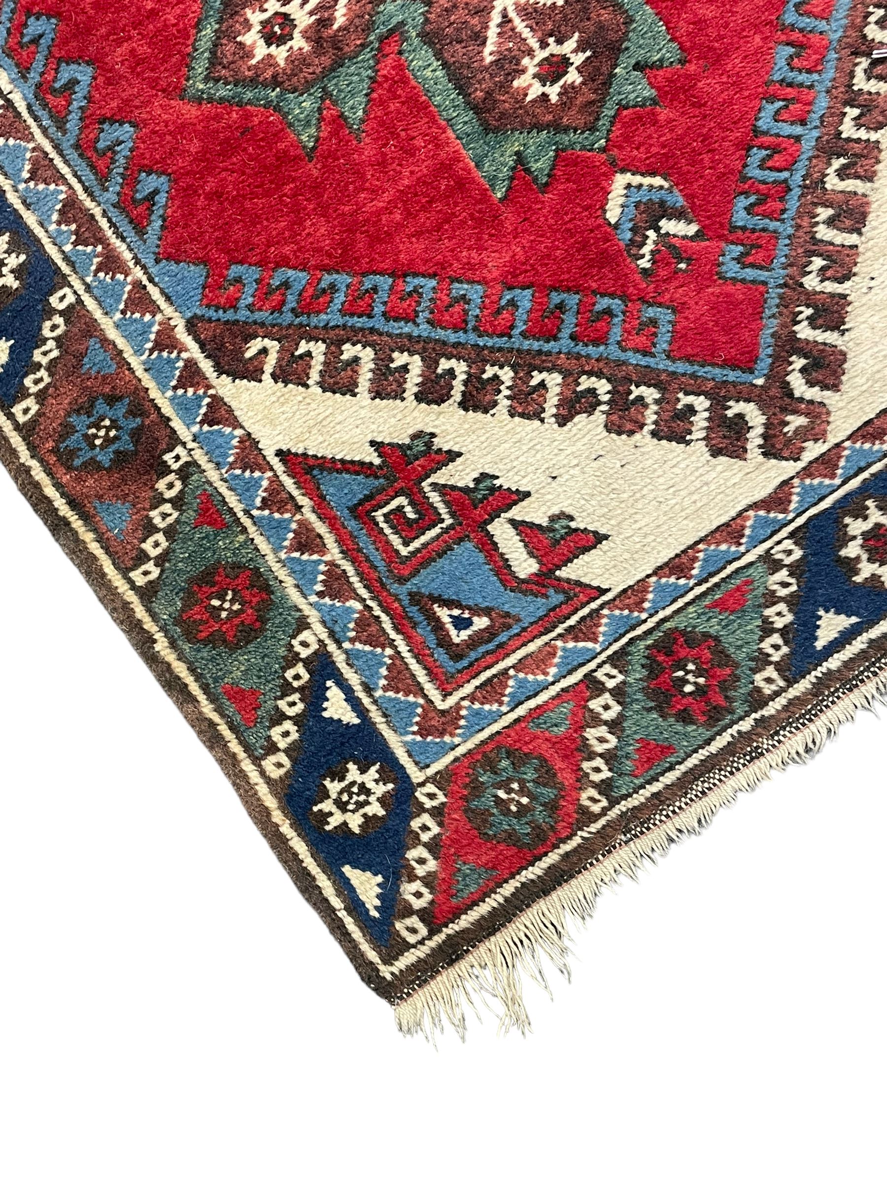Turkish red ground runner, seven star and leaf decorated medallions, geometric design repeating border