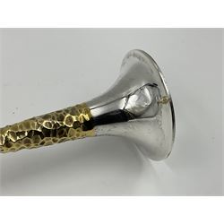 Pair of modern silver candlesticks by Stuart Devlin, the tapering parcel gilt stems with signature textured detailing, each supporting a fluted candle holder and upon a spreading circular foot, hallmarked Stuart Devlin, London 1973, H25cm