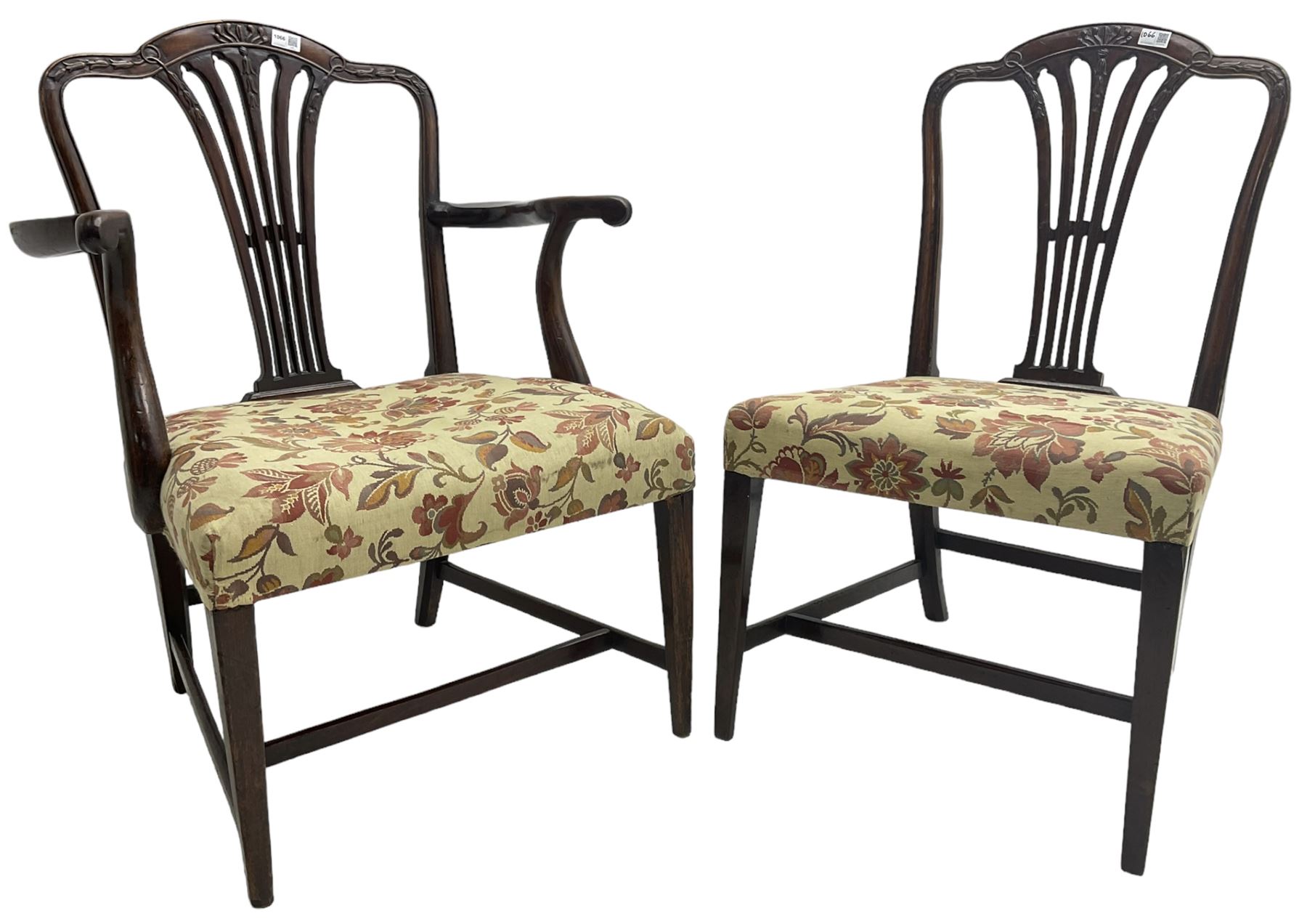 George III Hepplewhite design mahogany elbow chair and matching side chair, cresting rail carved with bellflowers over pierced and flared splat, seats upholstered in floral patterned fabric, raised on square tapering supports united by stretchers
