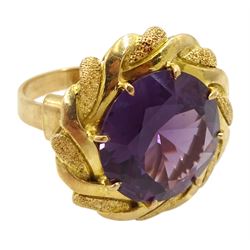 18ct gold circular purple stone ring