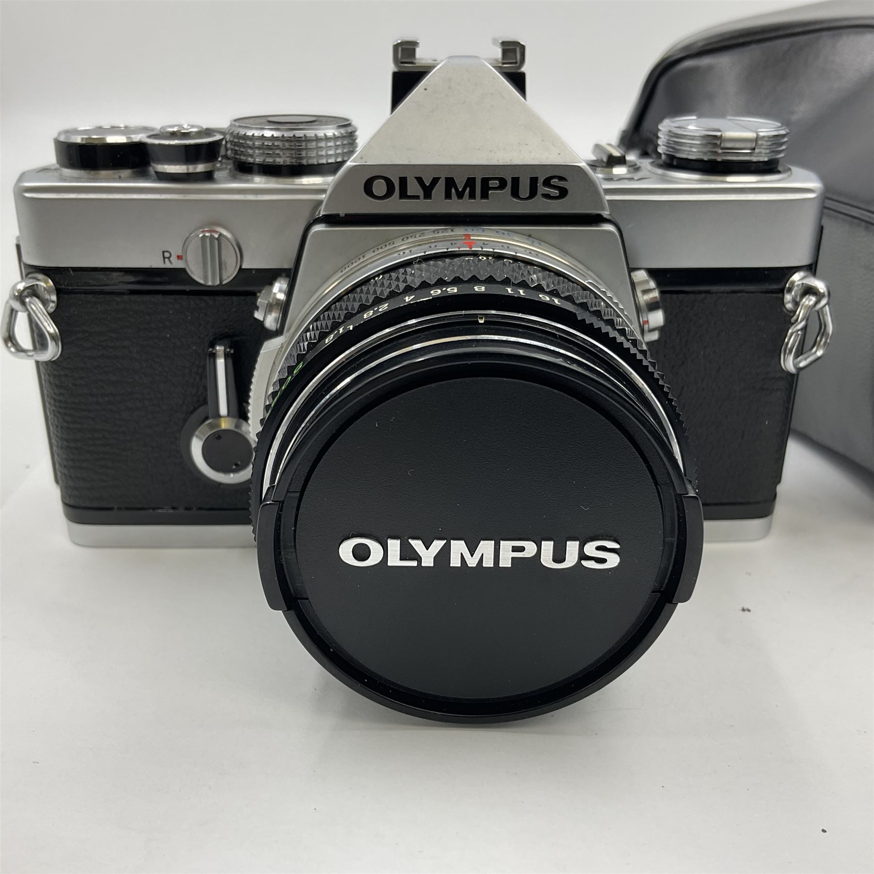 Olympus M-1 camera body, serial no. 110865, circa 1972, with ' Olympus M-System F.Zuiko Auto-S 1:1.8 f=50mm' lens, serial no. 105152, in leather case 