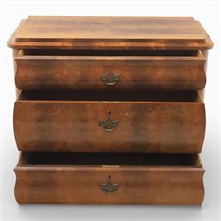 Late Victorian walnut and burr walnut chest of drawers, moulded top with rounded corners, finely figured burr walnut drawer fronts arranged as three long drawers, brass batwing handle plates, the lower section raised on turned bun feet