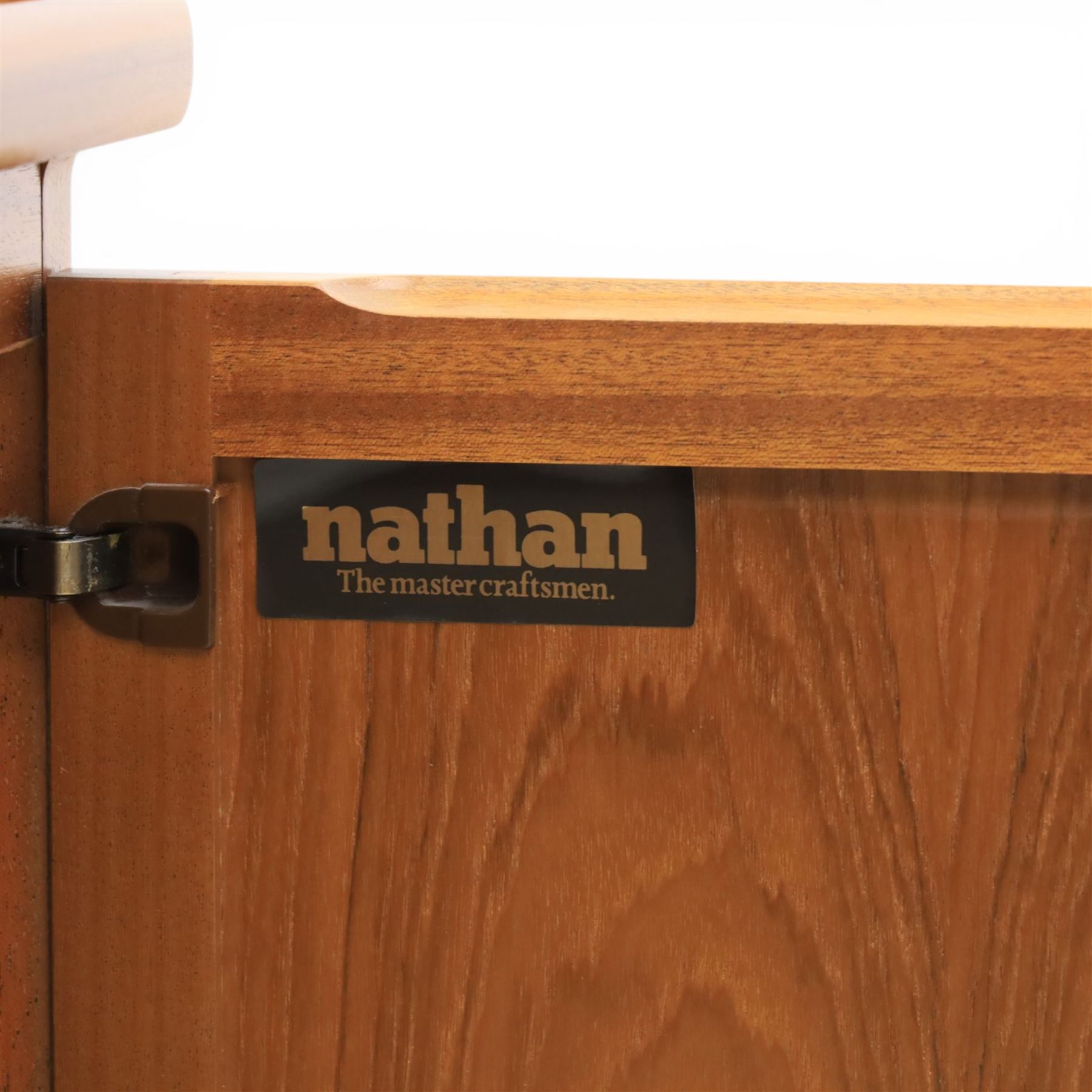 Nathan - teak sideboard and lamp table, both with signature square panelling, raised on a recessed plinth base (Lamp table H 51cm, D 46cm, W 52cm)