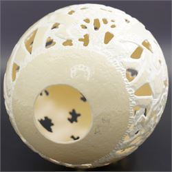 Ostrich egg with pierced decoration, depicting elephants in a forest, H16cm