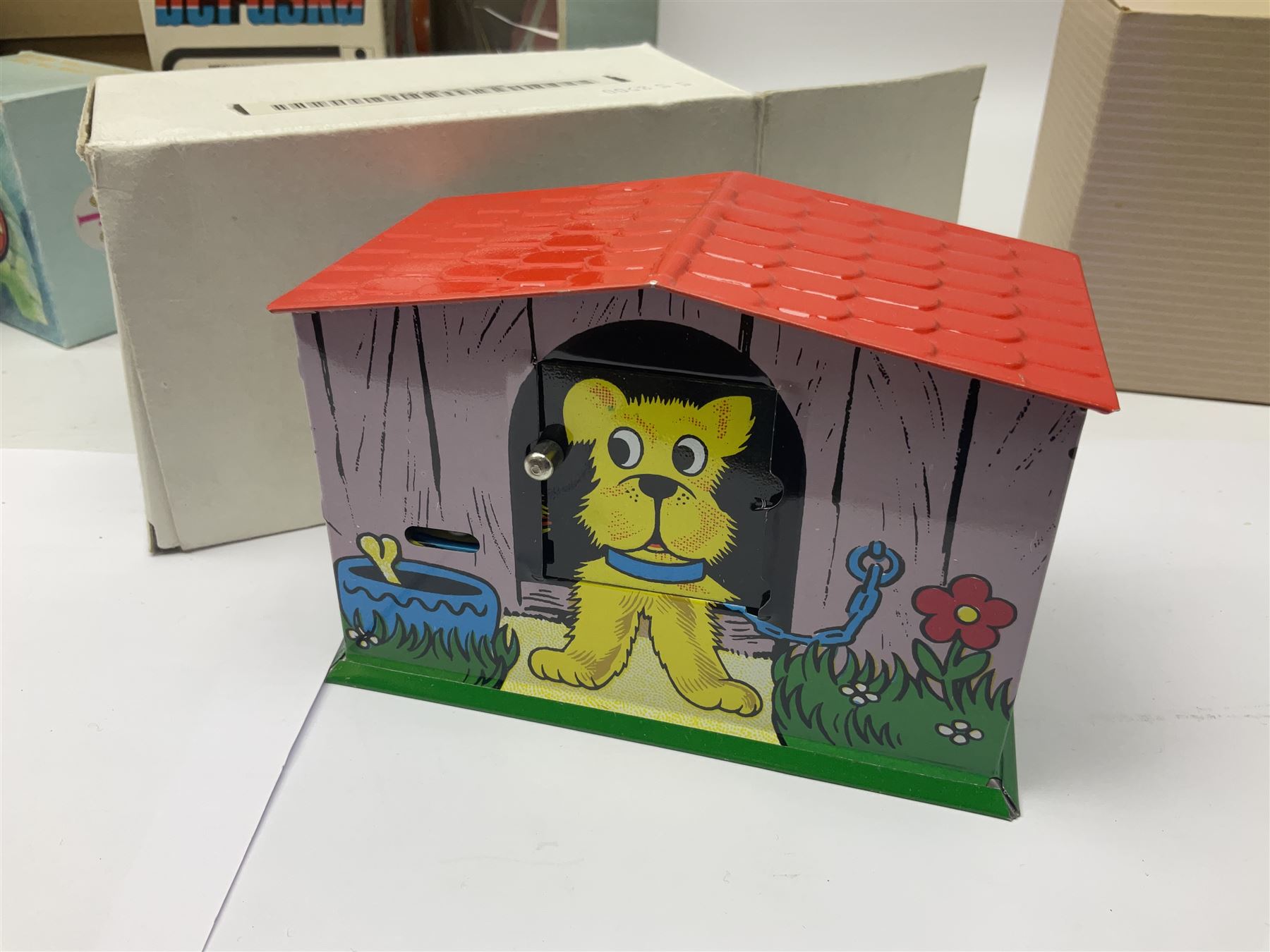 Twenty six tinplate models to include Ferris Wheel and Performing Circus Elephant, marked JW, further similar examples such as Duck on a Bike, Clown on Roller, Carousel; Popeye Tin Speedboat; Looney Tunes Wind Up Cars and Express Train; various international examples, MS107 Jumping Bambi, Pop Pop Boat, jumping frogs, pecking chickens etc; both boxed and loose