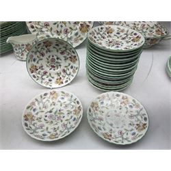 Minton Haddon Hall pattern tea and dinner wares, comprising two covered tureens, eighteen dinner plates, ten side plates, eighteen bowls, twenty dessert plates,  nineteen cups, twenty saucers, milk jug and two sucriers 