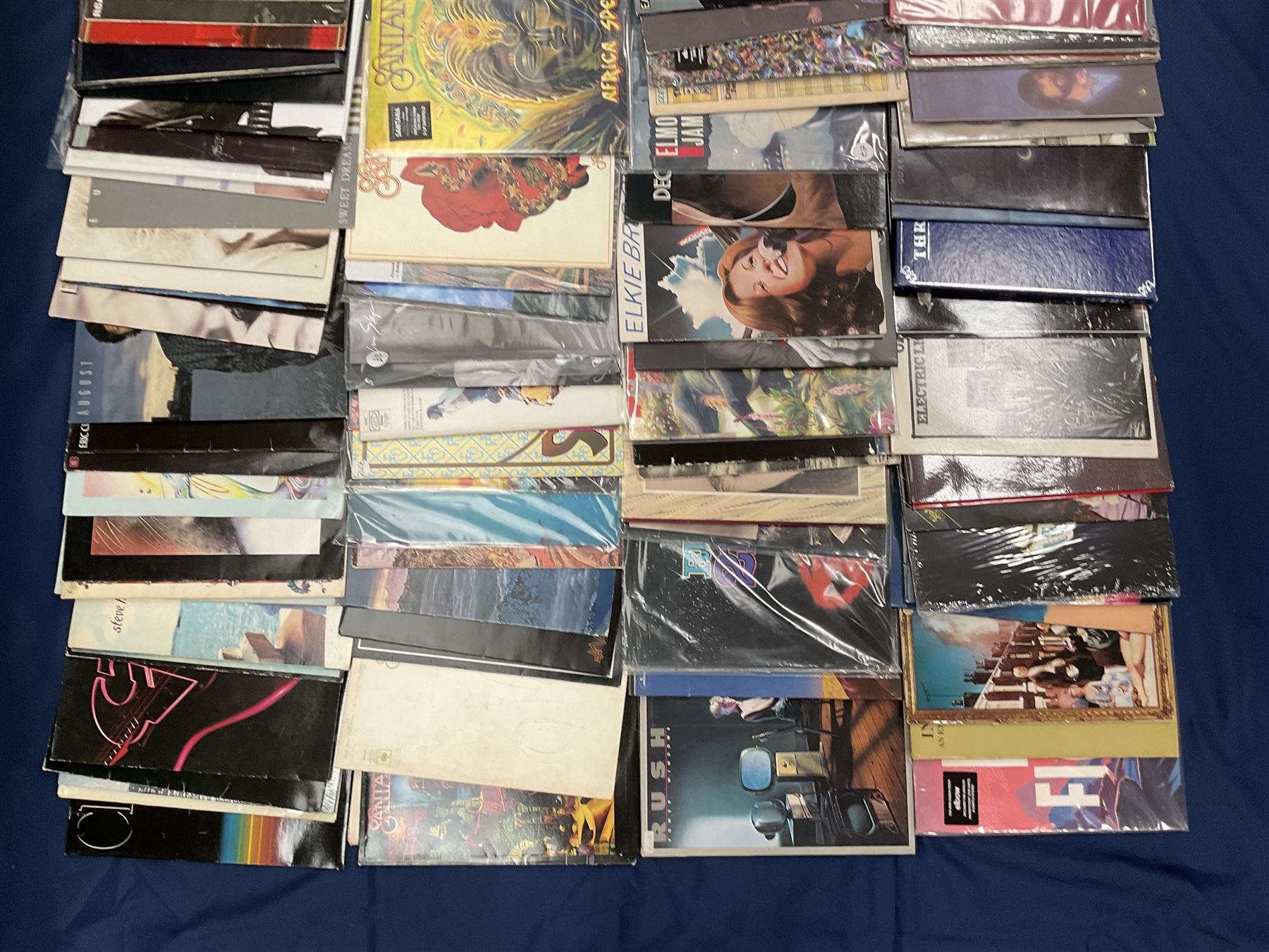 Quantity of vinyl records including Eagles 'Desperado', Electric Light Orchestra 'Balance Of Power', Rush '2112', 'Moving Pictures', Santana 'Festival', Eric Clapton 'No Reason To Cry' and other music, approximately 90, in one box