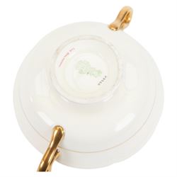Royal Doulton 'The Balmoral' pattern dinner service for twelve place settings, comprising dinner plates, soup bowls and saucers, side plates, cake plates, three graduating meat platters, pair of tureens with covers and a pair of sauce boats with saucers, all with printed marks beneath