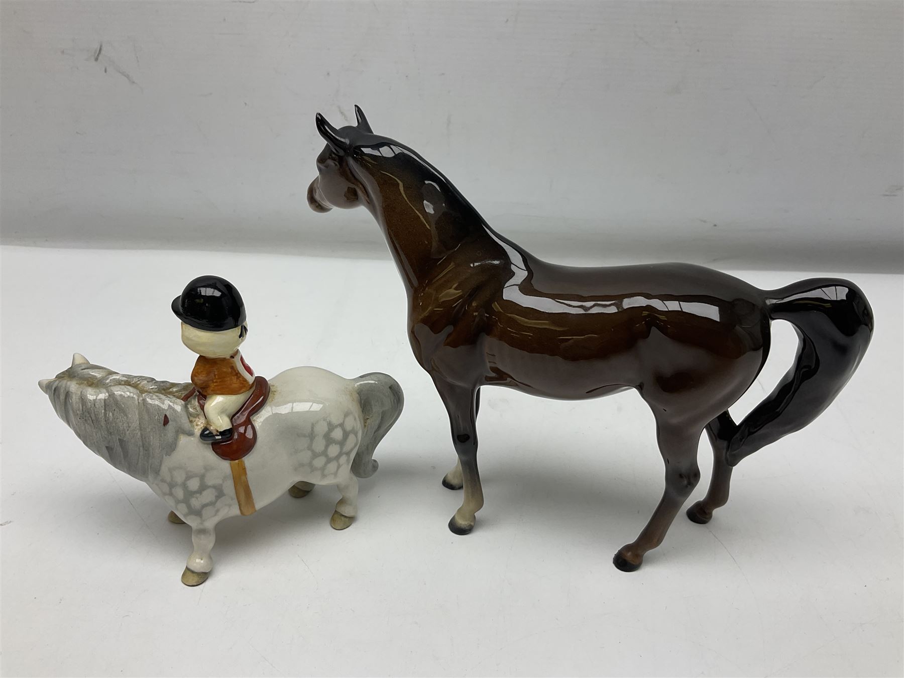 Beswick Champion of Champions Hereford bull figure no 1360, Beswick Norman Thelwell An Angel on Horseback no 2704A, and three other Beswick figures to include Arab Bay horse, Mallard and Comical Duck Family, all with printed or impressed marks beneath, largest H17.5cm