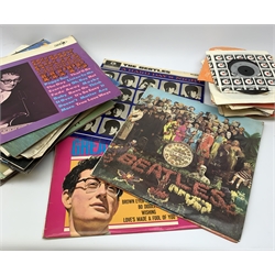 A selection of assorted vinyl records and singles, to include The Beatles Sgt Peppers Lonely Hearts Club Band, The Beatles A Hard Day's Night, Frank Sinatra's Greatest Hits, The Beach Boys, Buddy Hollys Greatest Hits, etc.