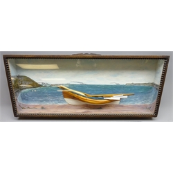  Early 20th century half block Diorama of the double ended Coble 'Nora Evelyn' on the beach, back and sides of the glazed front case painted with steam ships and trawlers between Filey Brig and Flamborough lighthouse, W85cm, H35cm, D18cm  