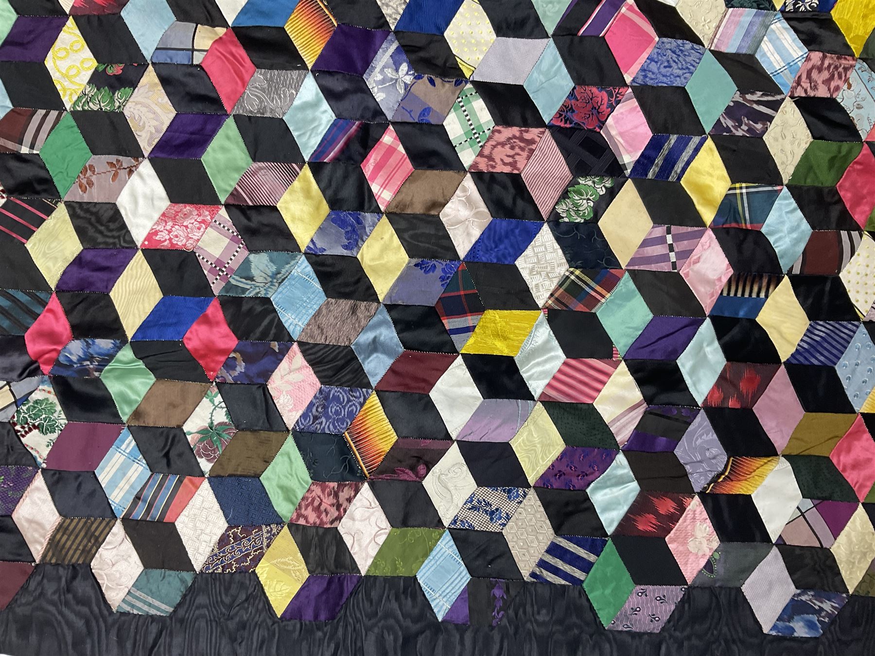 19th Century silk and satin tumbling blocks pattern patchwork quilt with black border 228cm X 196cm
