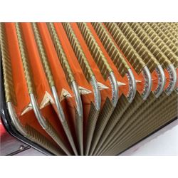 German Hohner student II compact accordion with 26 keys and 12 bass registers in a hard case With tutor