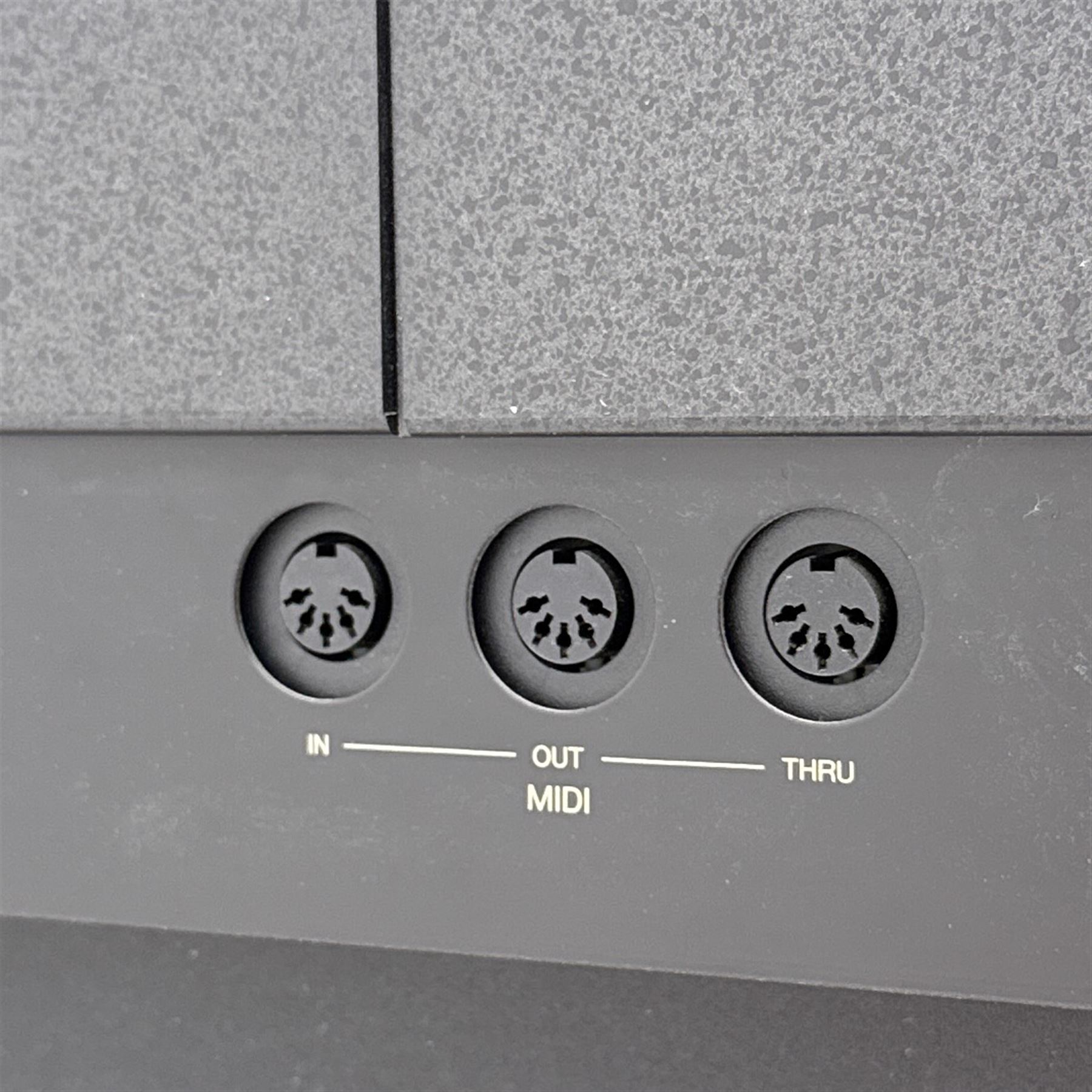 Yamaha Clavinova CLP-550 digital piano, full-size weighted keyboard with integrated pedals and speakers, in dark wood effect casing, accompanied by matching padded bench, Sennheiser headphones, original manuals, and factory-issued cassette tape titled 'Pure & Simple – CLP Digital Pianos'