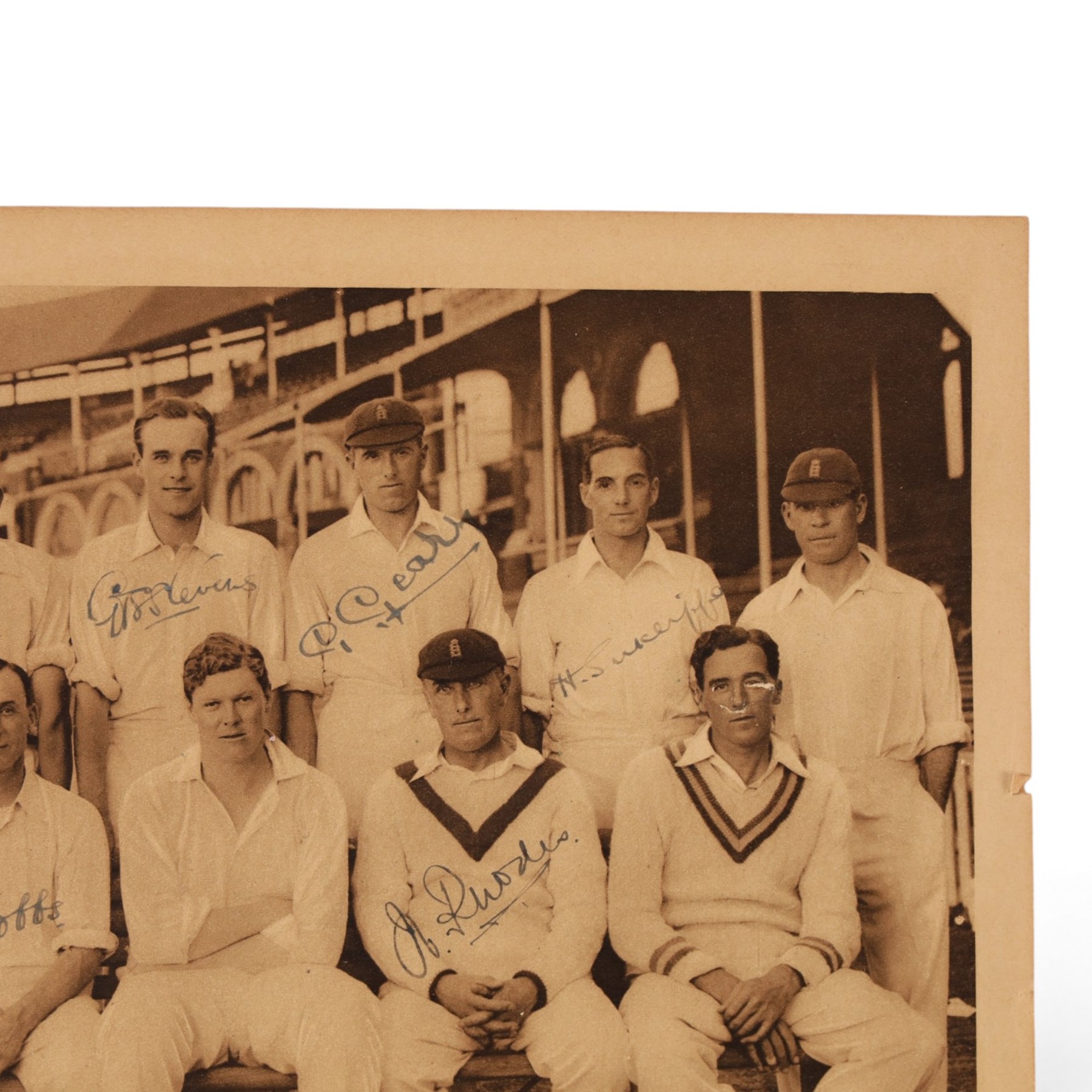 1920s All Sports Illustrated magazine page, depicting the 1926 Ashes winning England cricket team, signed by seven players including Maurice Tate, Greville Stevens, George Geary, Herbert Sutcliffe, Herbert Strudwick, Jack Hobbs and Wilfred Rhodes, mounted on card