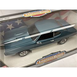 Four Ertl American Muscle 1:18 scale die-cast models - 1969 Pontiac GTO; 1970 Ford Boss 302 Mustang; 1957 Chevy bel Air; and 1967 Corvette L-71
