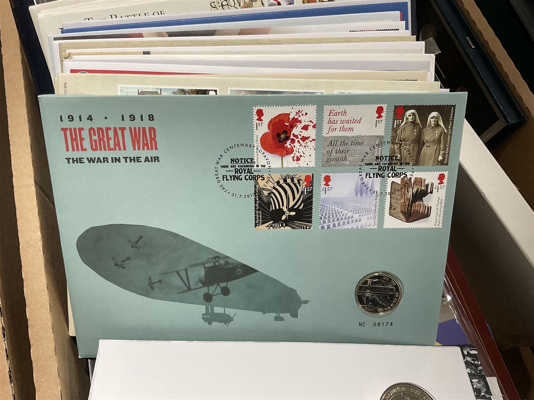 Approximately one hundred and fifteen Royal Mint coin covers, in two ring binder folders and loose, together with approximately 53 grams of Great British pre-1920 and approximately 68 grams of Great British pre-1947 silver threepence coins, and a small quantity of further pre-decimal coins