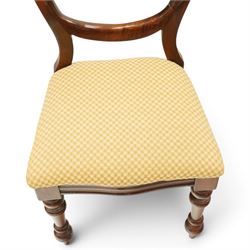 Set of eight mahogany balloon-back dining chairs, drop-in seats upholstered in yellow patterned fabric, raised on turned-front and rear-splayed supports