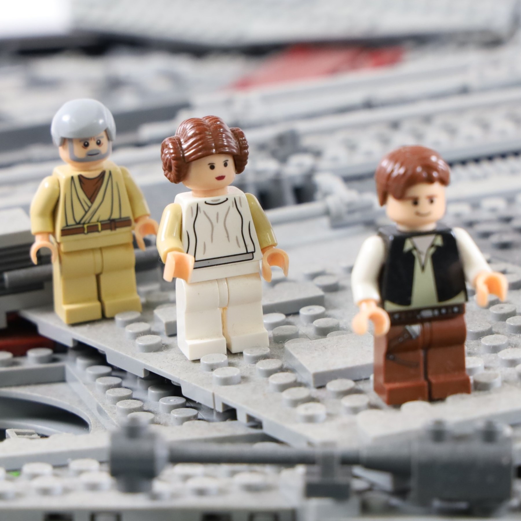 Three Lepin Star Wnrs built models, comprising Red Five X-Wing Starfighter no. 05039, Millennium Falcon no. 05132 and Super Star Destroyer no. 05028