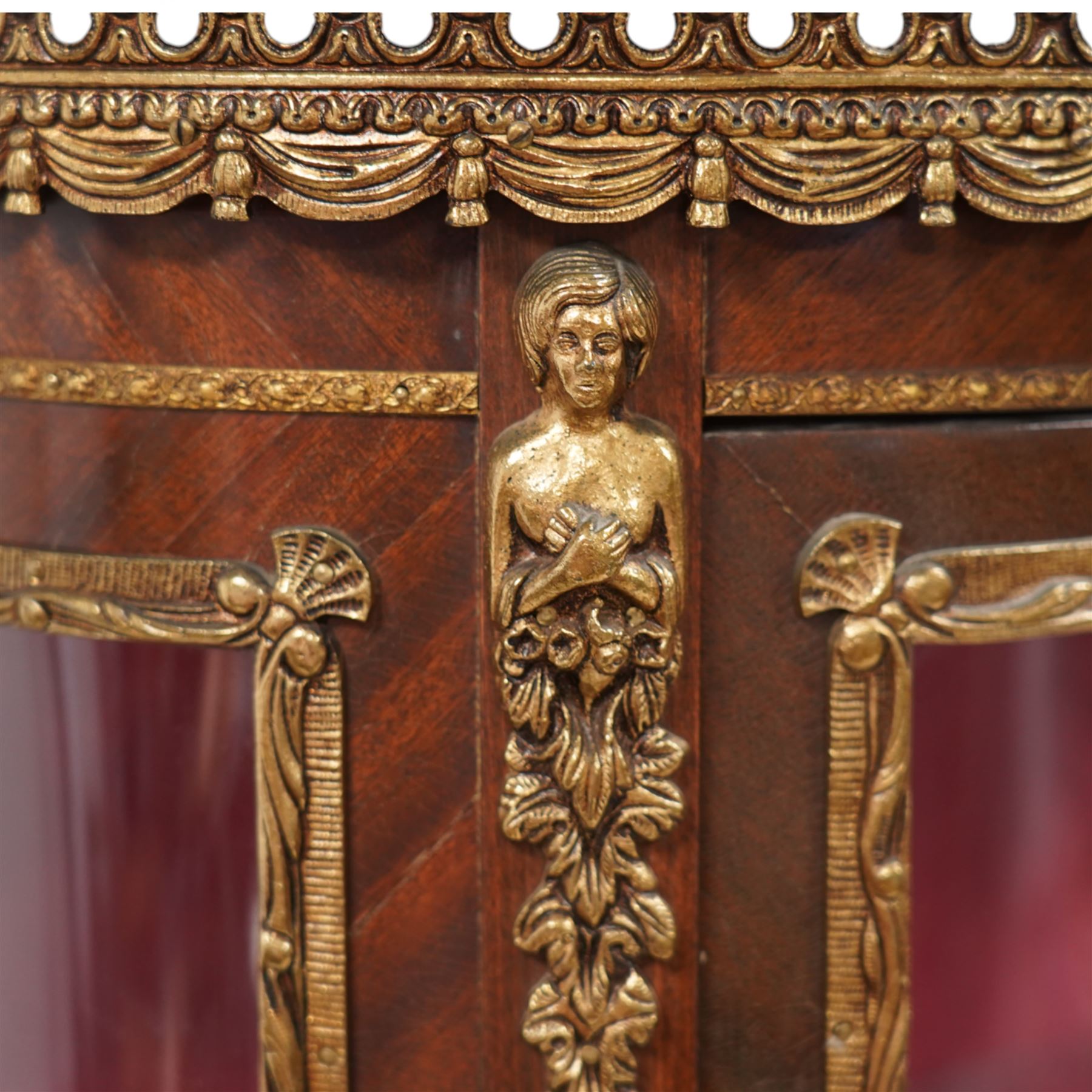 Mid-20th century rosewood vitrine display cabinet, shaped form with cast gilt metal gallery and mounts, enclosed by glazed door with Vernis Martin design panel, fabric lined interior with two glass shelves, on cabriole supports with cast acanthus leaf mounts 