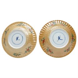 Two Chinese Kangxi period famille verte cafe au lait saucers, decorated with native animals among foliage, with indistinct mark within double rings beneath, D14cm 