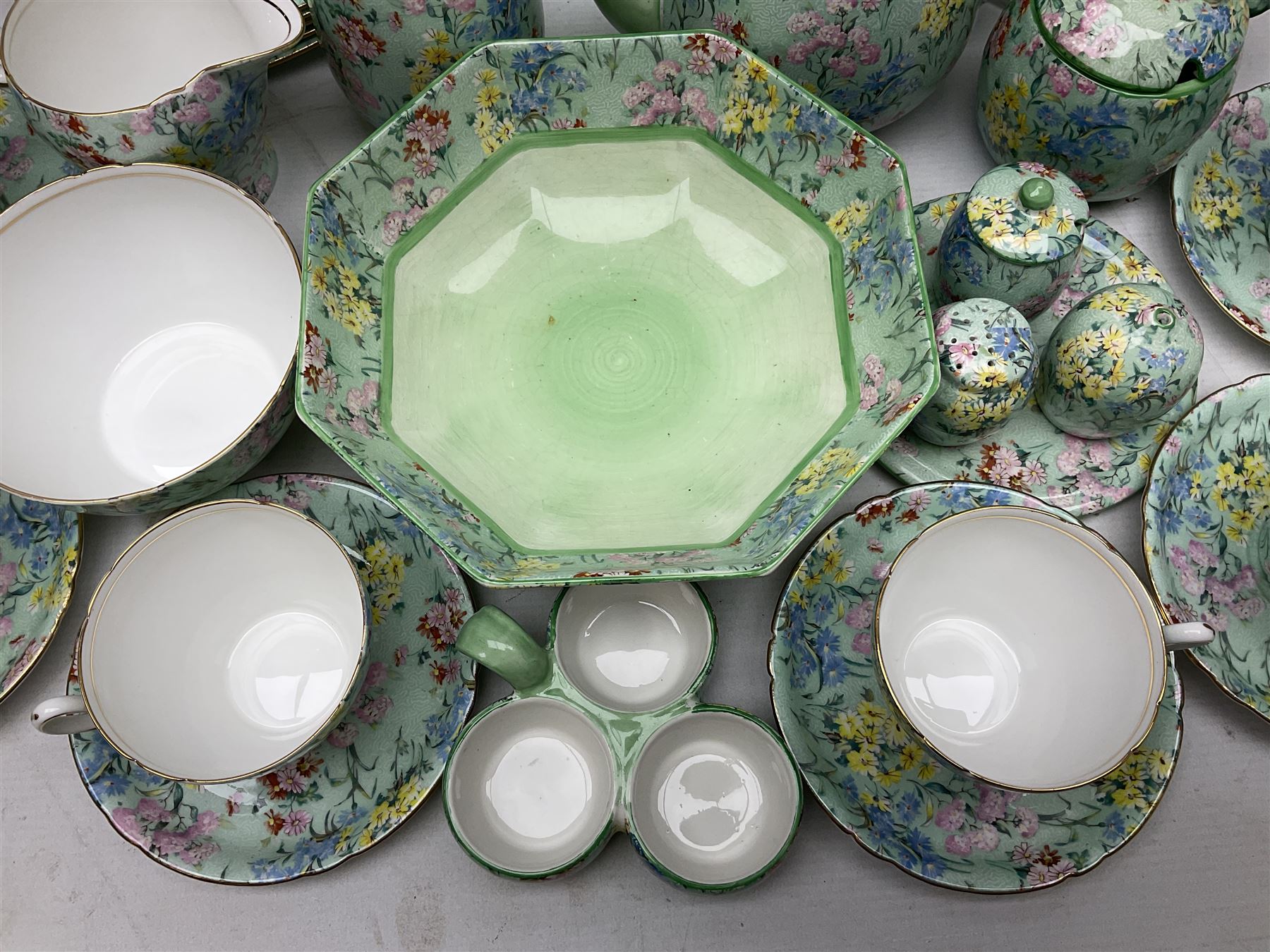 Shelley Melody pattern tea service for six, to include teapot, teapot stand, hot water jug, milk jug, covered sucrier, teacups and saucers, cake plates etc (31)