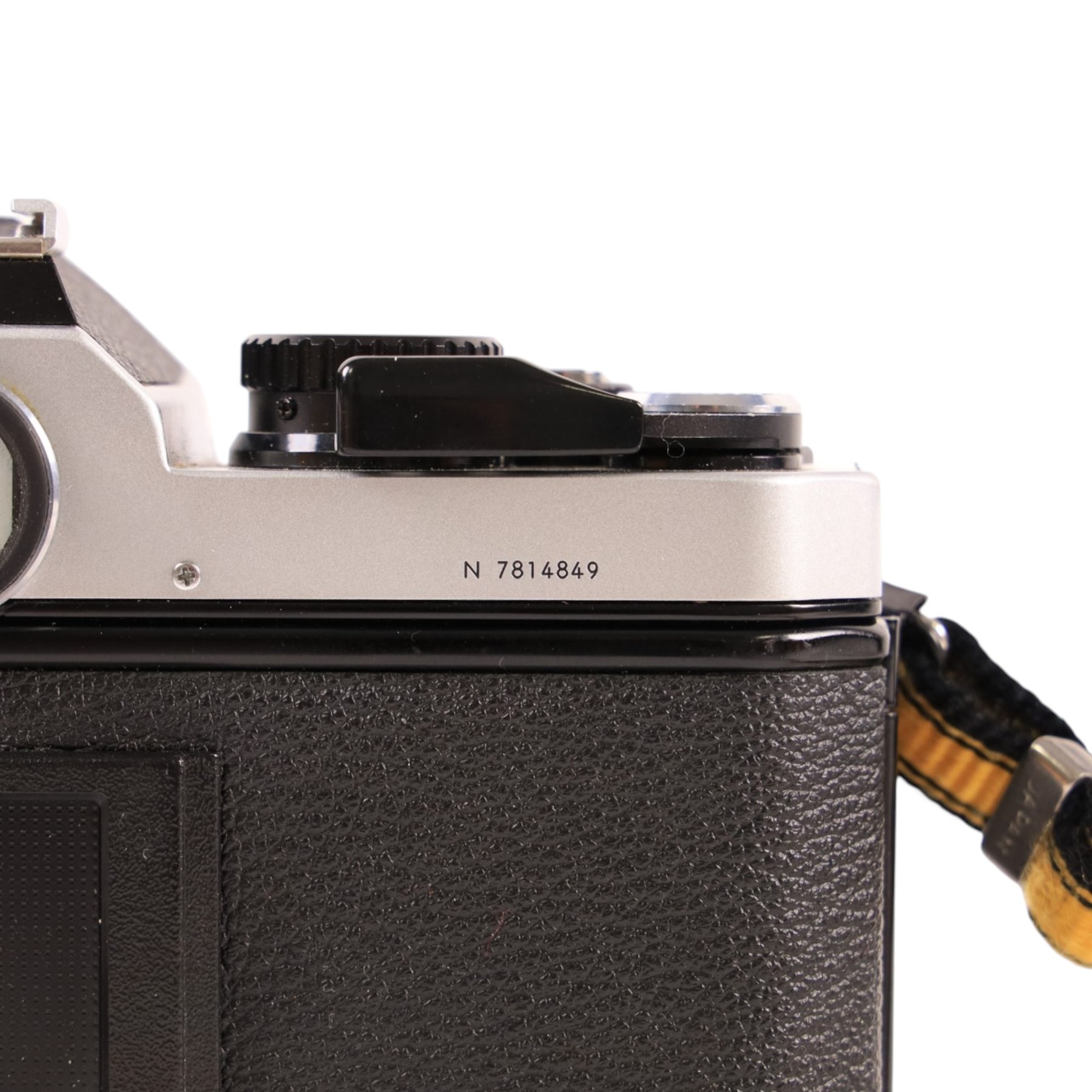 Nikon FM2 film camera body serial no. 7814849 with a Sigma 24mm lens serial no.5083190, camera user manual and Nikon carrying case