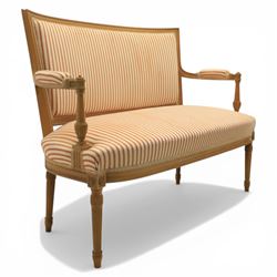 20th century Louis XVI style beech salon suite, comprising settee and four chairs, the settee with shaped rectangular back and upholstered arms over a shaped seat, the chairs with rectangular backs and overstuffed seats, each upholstered in striped fabric with close-nailed borders, upon fluted tapering supports headed by carved paterae, terminating in toupie feet, chairs H89cm W47cm