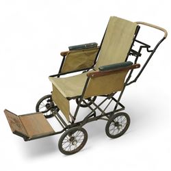 *Early 20th century invalid chair, the tubular metal frame with folding mechanism, canvas ...