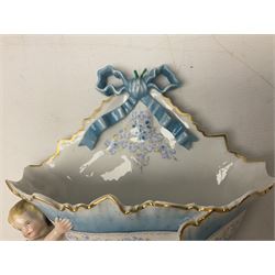 Continental wall pocket applied with two putti and ribbons and decorated with blue and gilt flowers H32cm