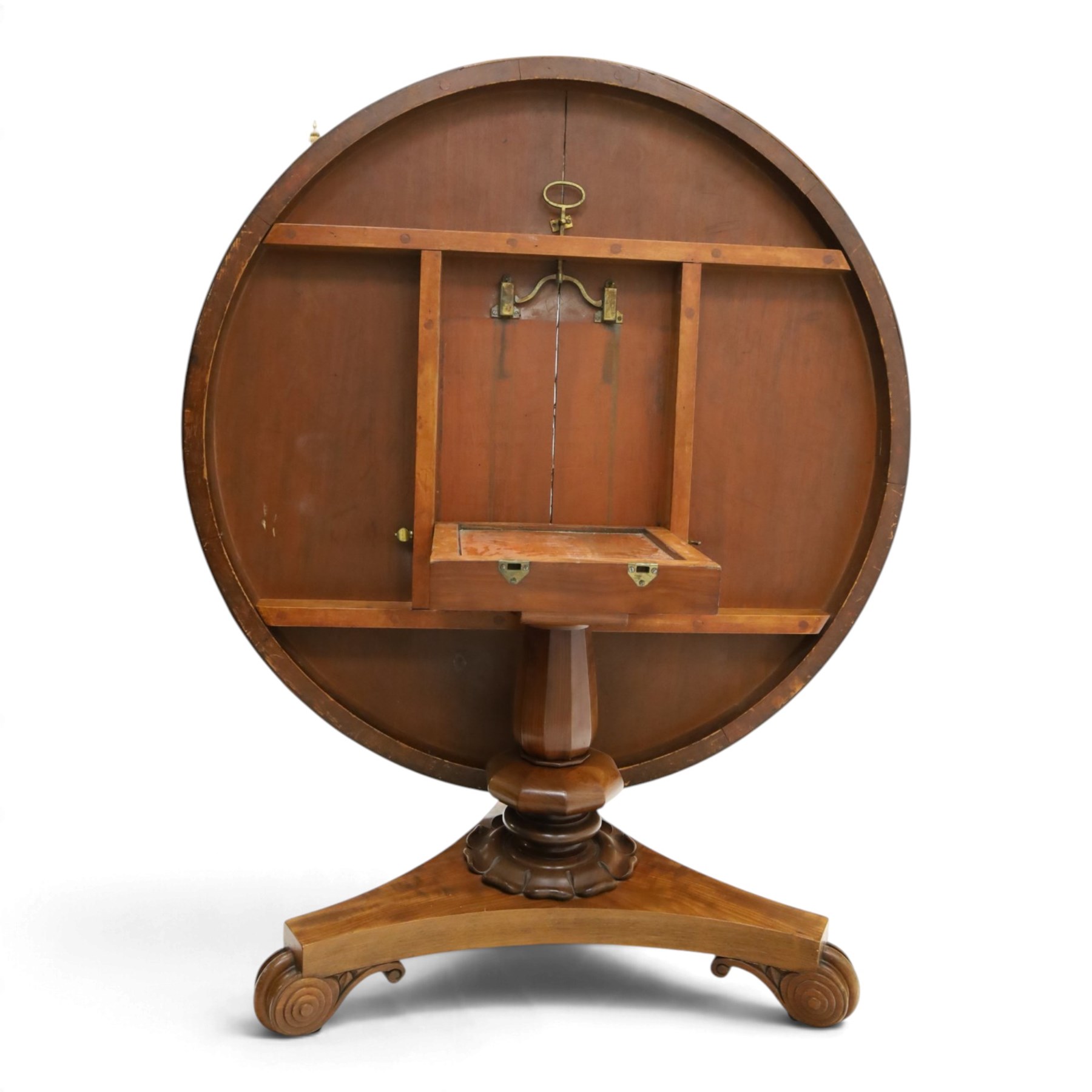 William IV mahogany circular breakfast table, banded frieze over a turned decagon pedestal with lappet carved collar, terminating to a triform platform base with scroll feet and castors