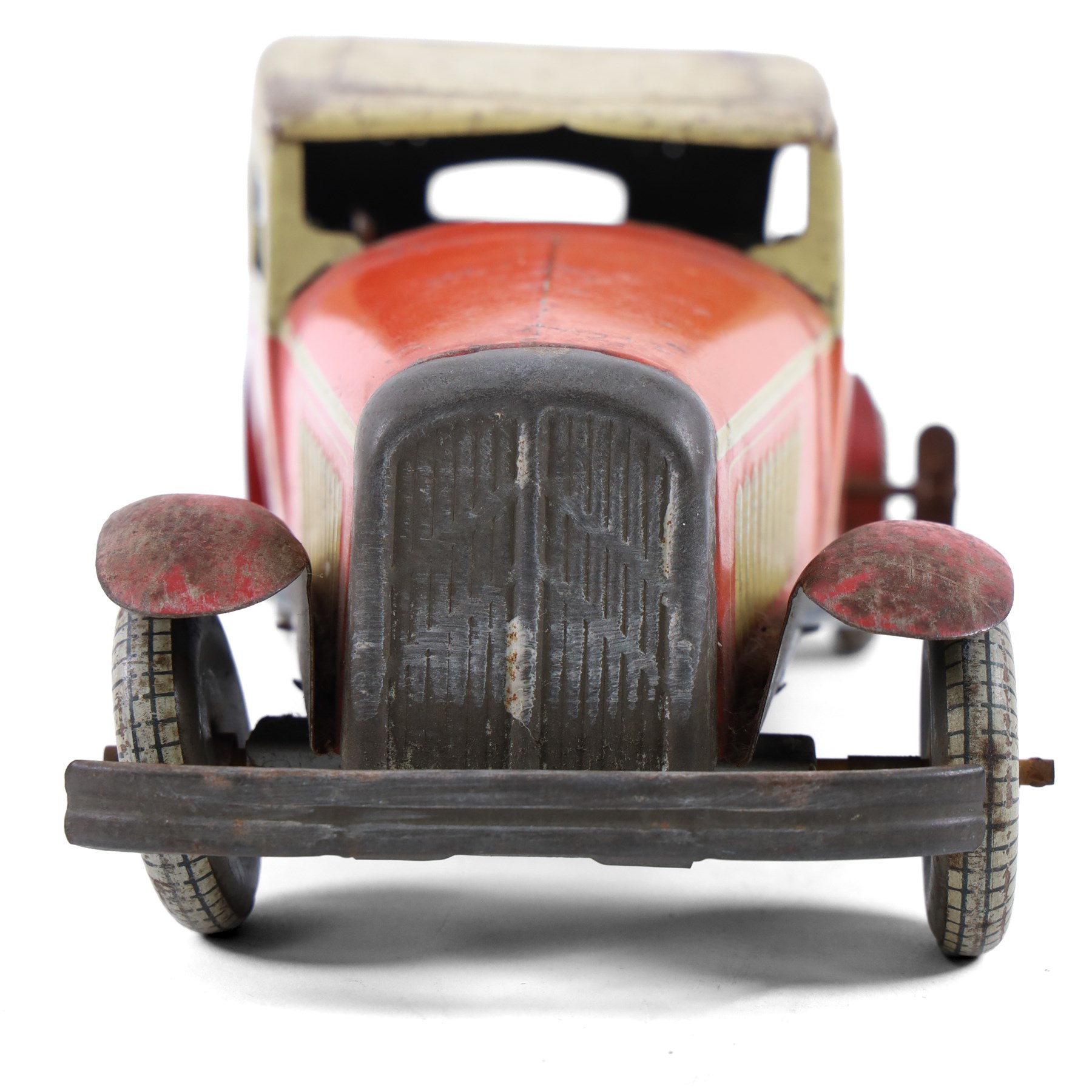 Mettoy tinplate clockwork Citroen saloon car, red orange body with cream roof and windows, with driver, Dunlop tyres and key, H9cm, L26cm