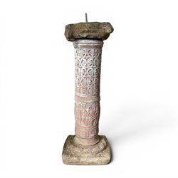 Weathered cast stone sundial, shaped top with metal dial, patterned column