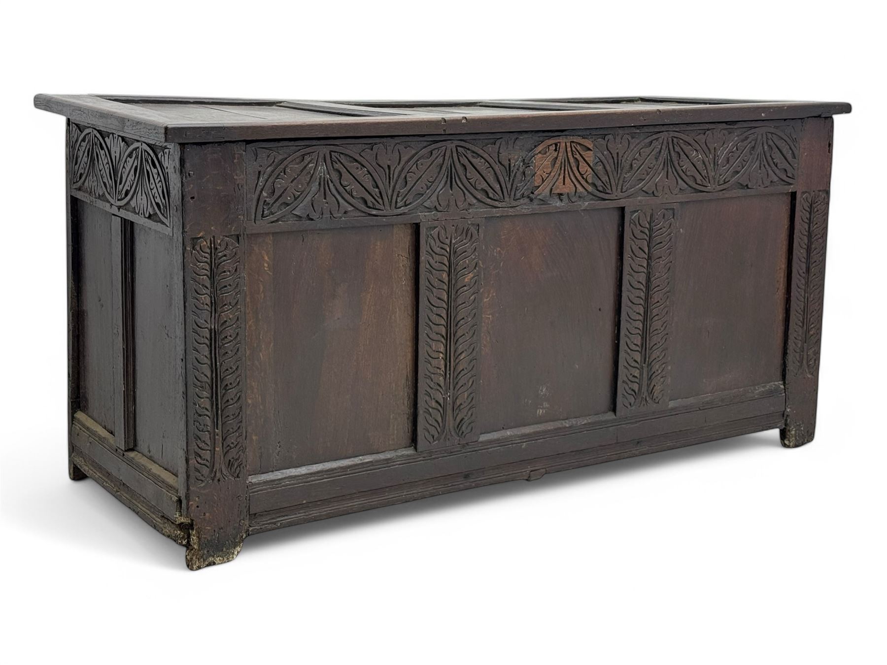 18th-century carved oak blanket chest with hand-carved floral and leaf motifs 