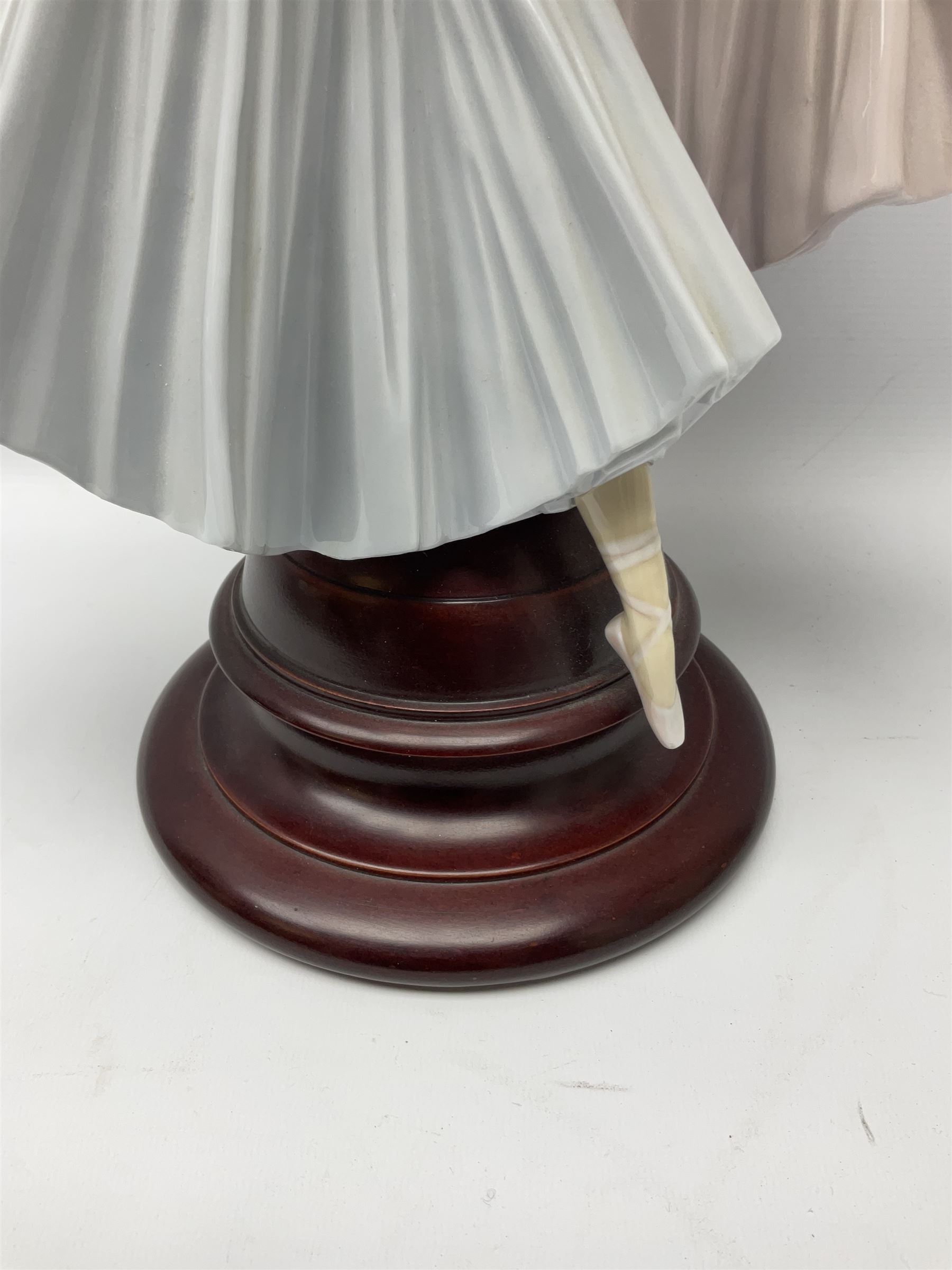 Lladro figure group, 'Merry Ballet', modelled as two ballerinas in dancing pose, raised on a turned socle base, no. 5035, printed marks beneath, H49cm