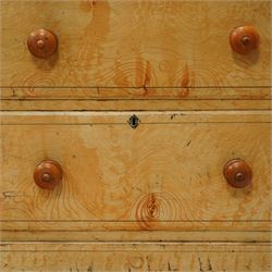 19th century pine painted chest of drawers, rectangular moulded top above two short and three graduated long drawers, each with painted foliate scroll and line detailing, turned knobs, and concealed turned feet, the sides with rounded corners and ebonised detail