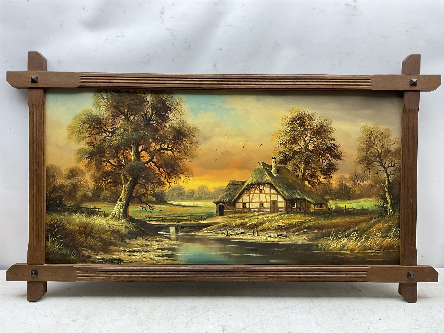 Horst Baumgart (German 1932-): Thatched Cottage II, oil on canvas signed 48cm x 98cm in cruciform oak Oxford frame