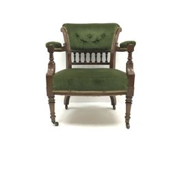 Late Victorian walnut framed tub shaped armchair, upholstered back seat and arms, gallery splat, turned supports, W67cm