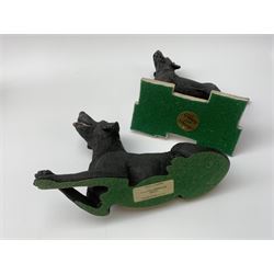 Two Border Fine Arts models, the first example a black Labrador, by Margaret Turner, upon oval wooden base, the second example a Dogs Galore Black Labrador, together with a Sherratt and Simpson model of a black Labrador